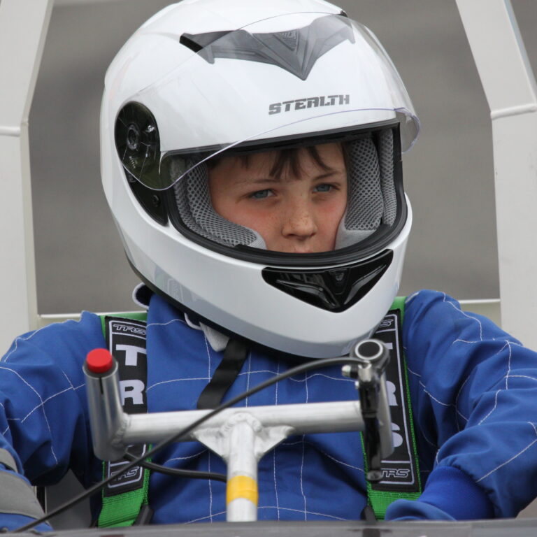 student in a go kart